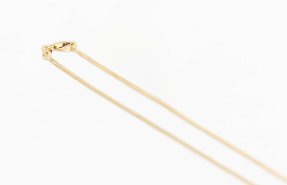 Collier maille cobra en or jaune et blanc et diamant