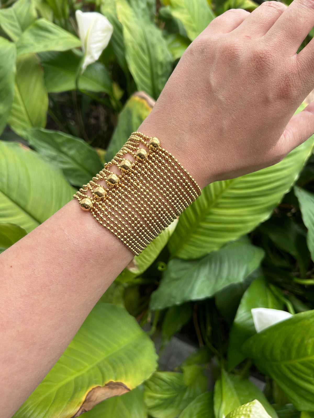 Bracelet manchette CARTIER Draperie grand modèle en or jaune, avec son certificat d'origine