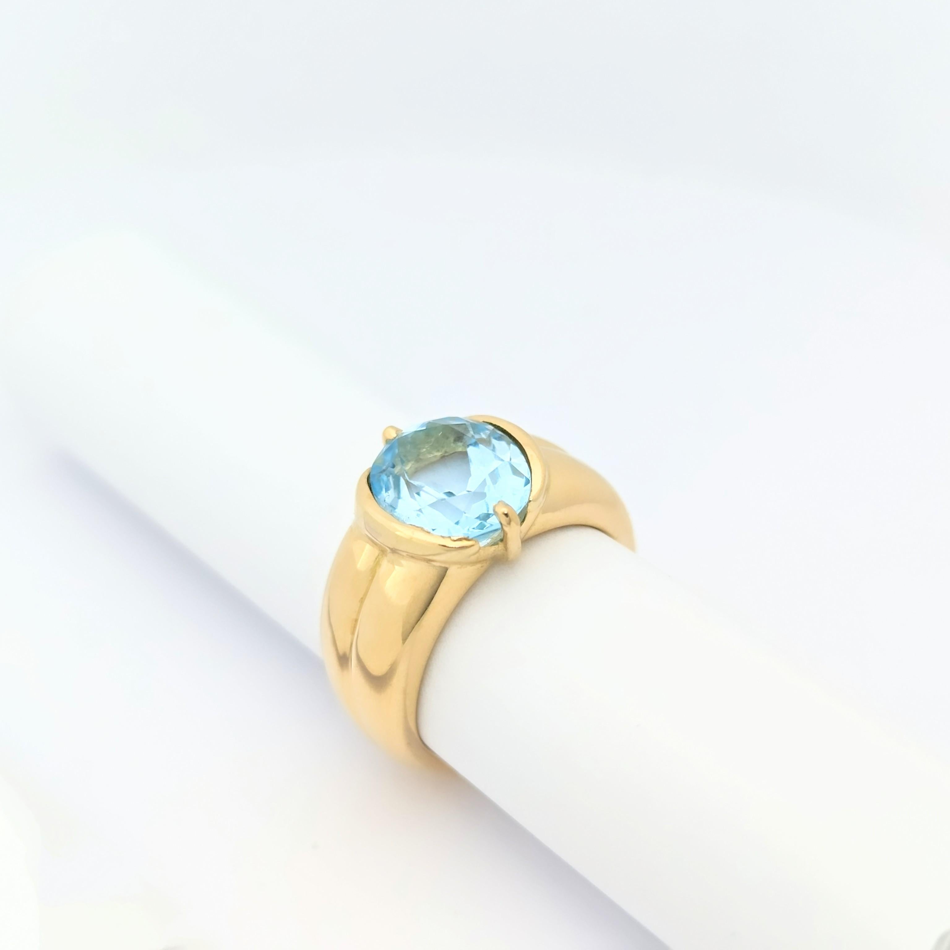 Bague en or jaune et topaze