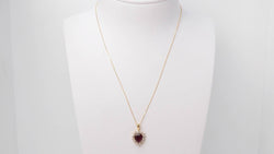 Collier pendentif coeur en or jaune, diamants et rubis