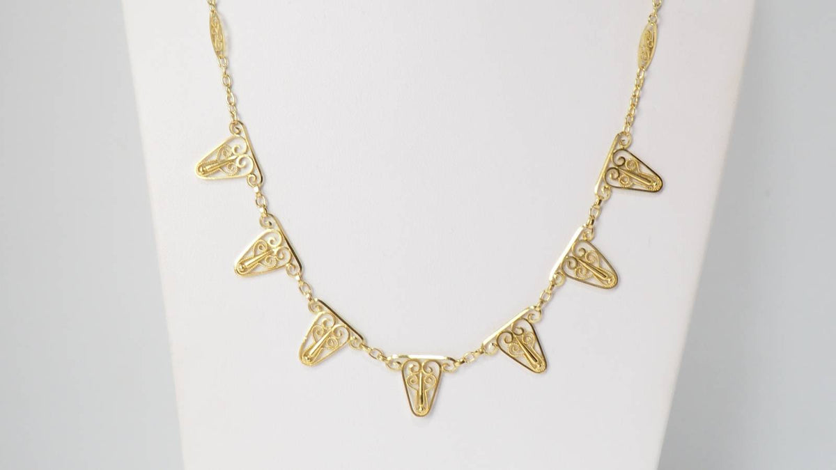Collier draperie en or filigrané