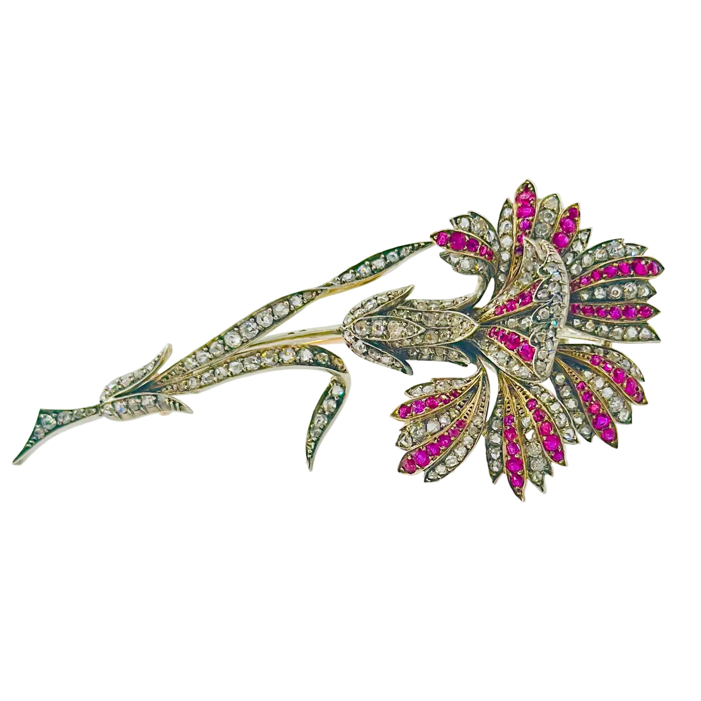 Broche Épingle en or jaune, argent, rubis et diamants