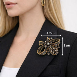 Broche en or jaune, argent et diamant