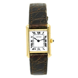 Montre CARTIER Tank Louis médium en or et saphir