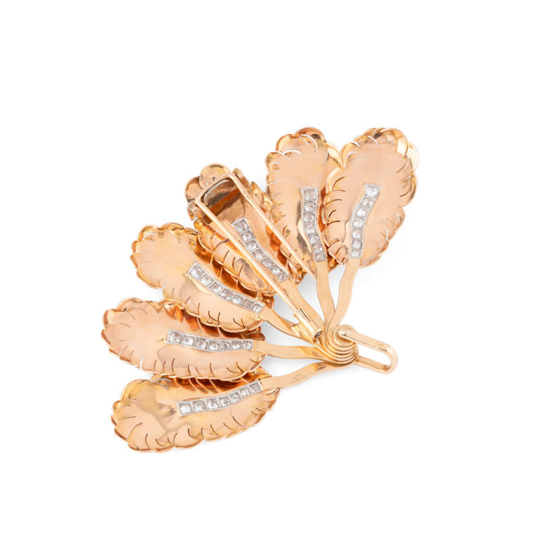 MELLERIO “Fan” clip brooch in yellow gold, platinum and diamonds