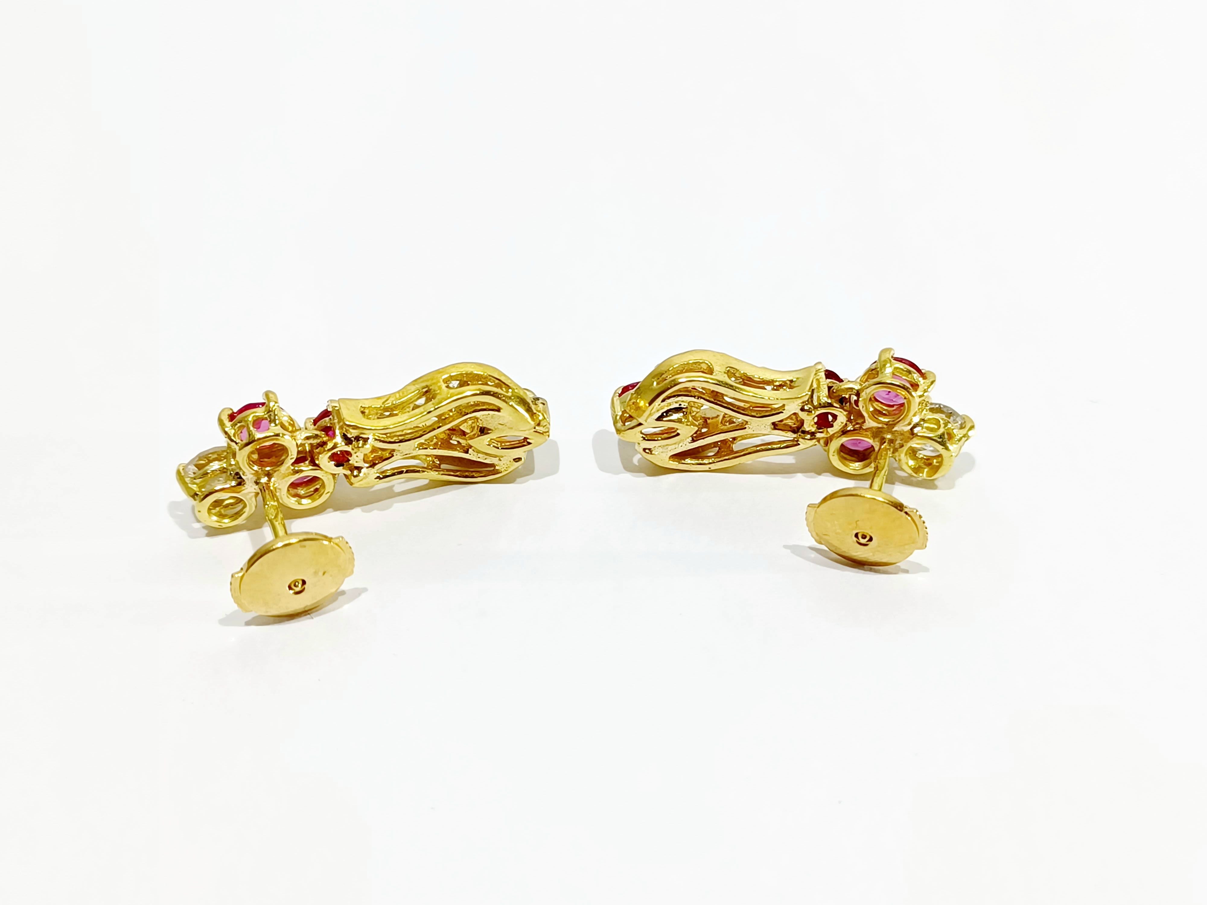 A Pair Of Gold, Ruby And White Earrings diamonds