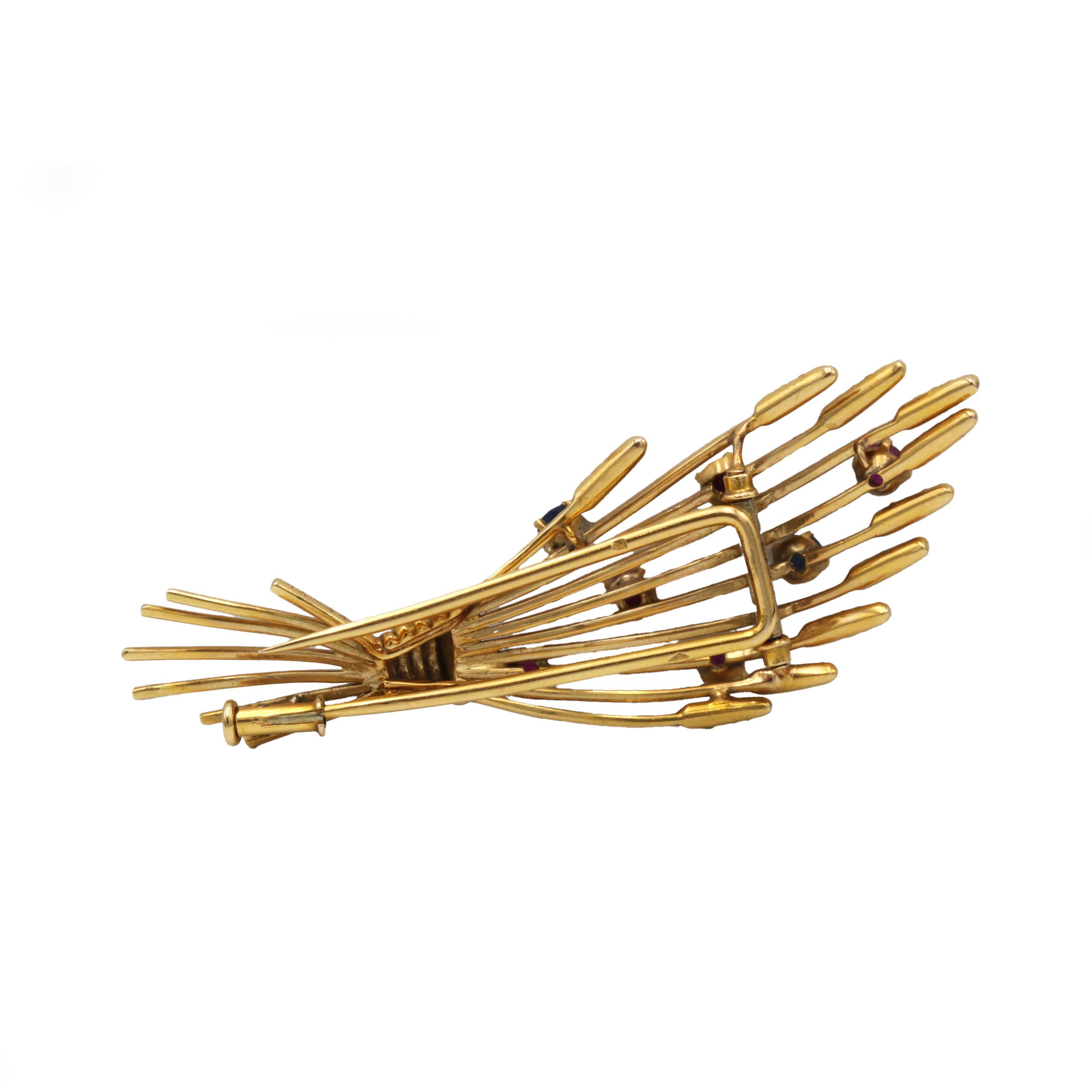 Broche Clip MELLERIO en or jaune, rubis et saphirs