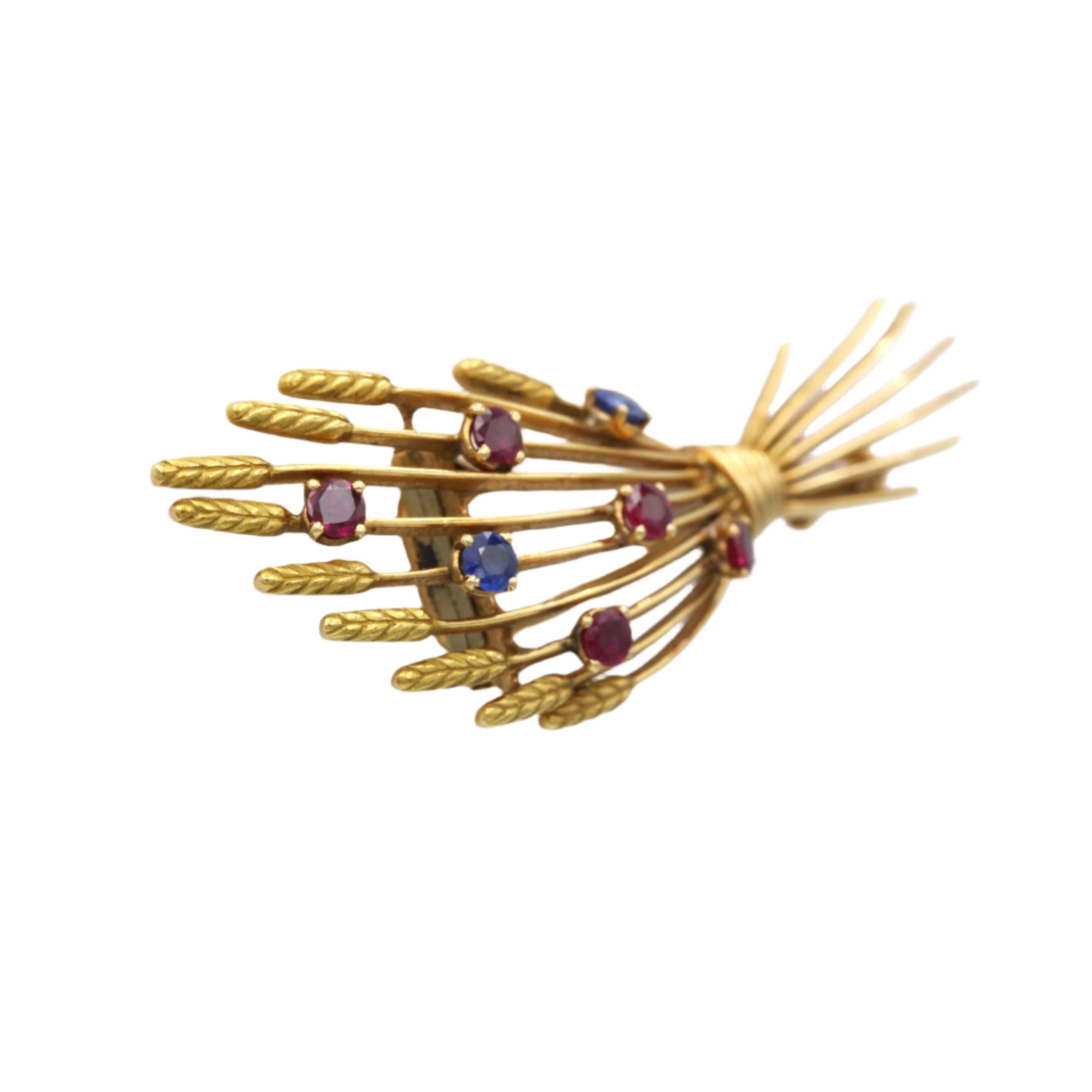 Broche Clip MELLERIO en or jaune, rubis et saphirs