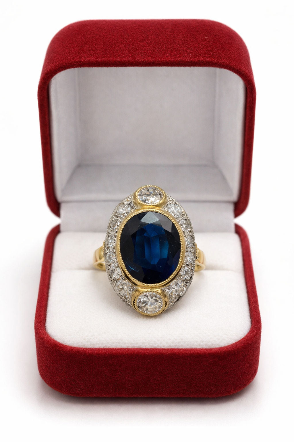 ANILLO DE ZAFIRO AZUL Y DIAMANTES EN ORO AMARILLO CON VISTAS EN PLATINO