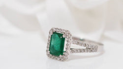 White gold emerald and diamond ring 