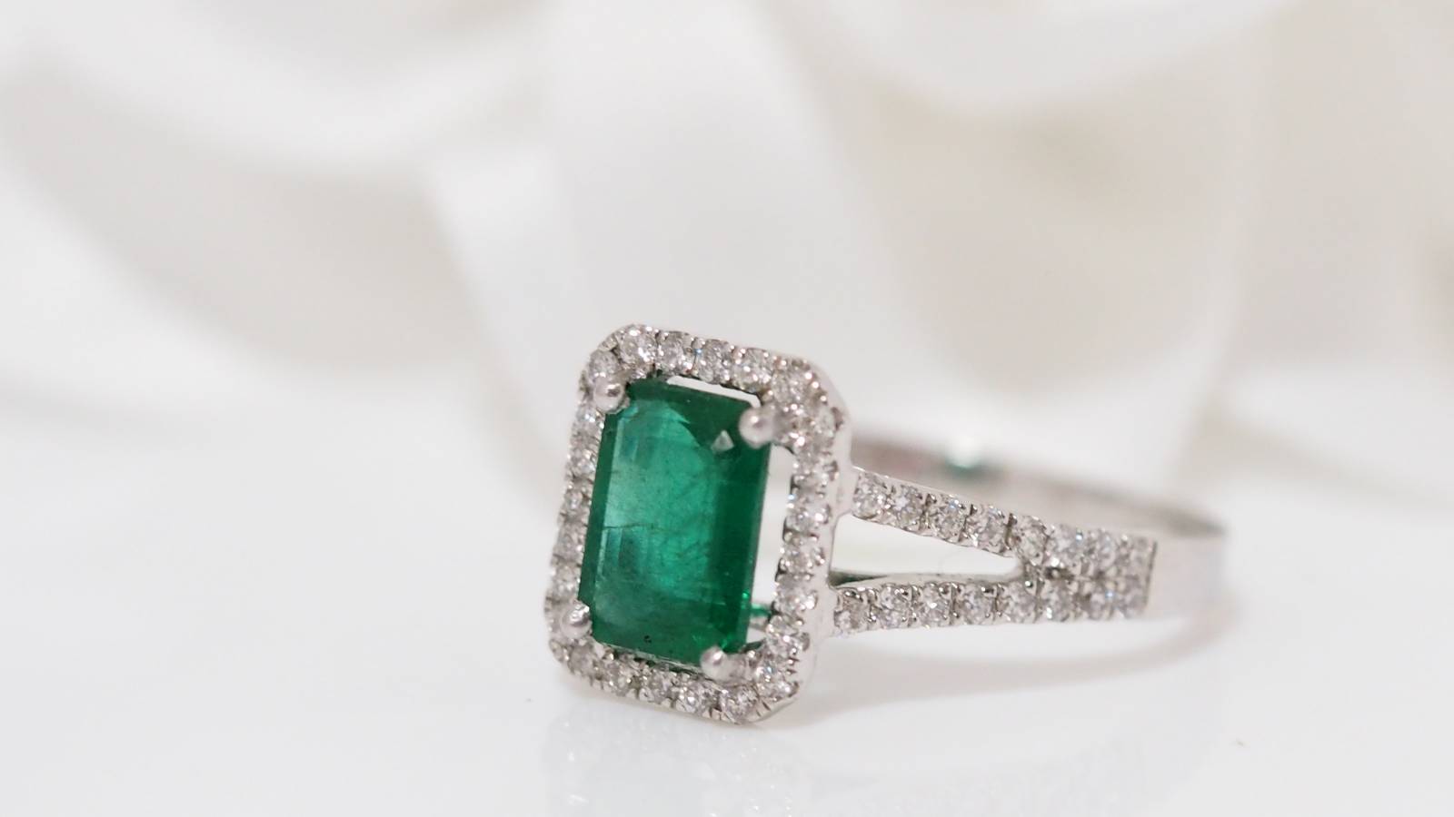 White gold emerald and diamond ring 