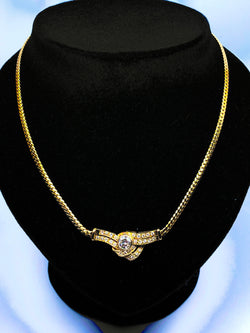 Collier en or jaune 18 carats et motif en diamants