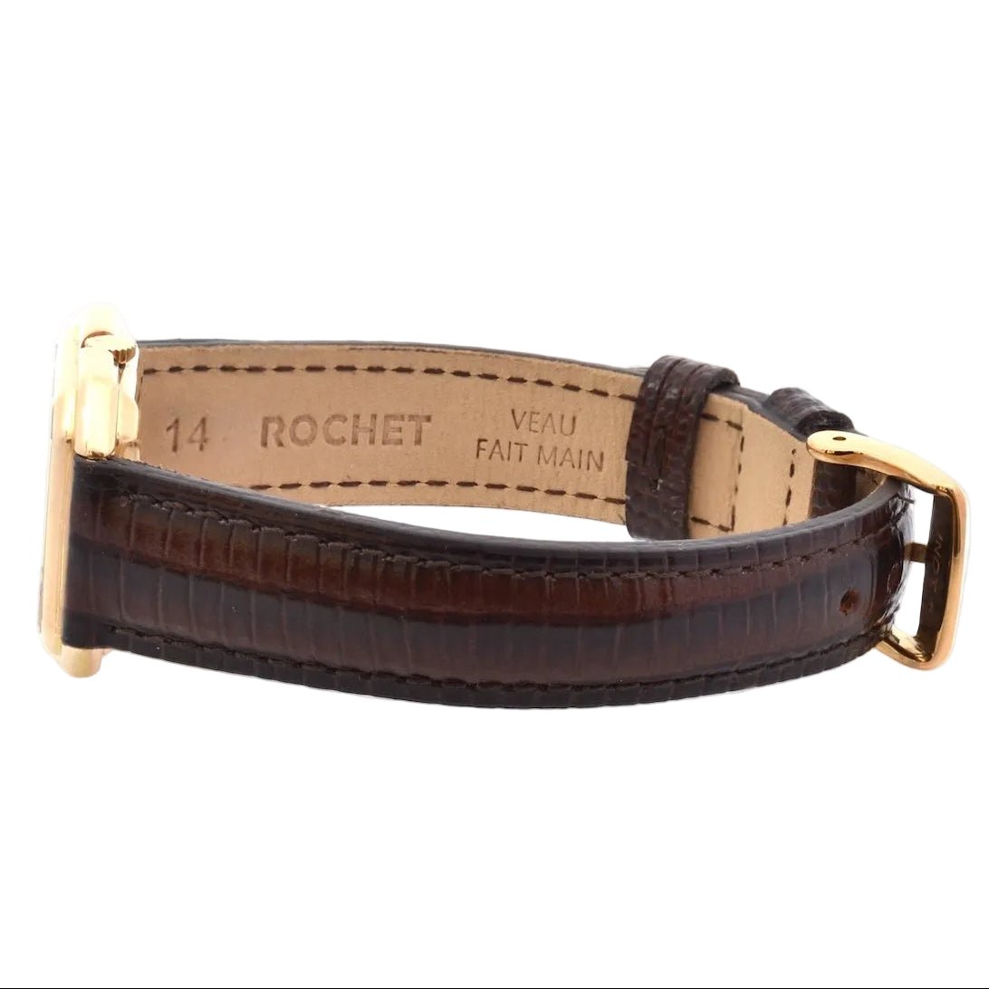 Montre BAUME & MERCIER en or jaune, cuir et saphir - Castafiore