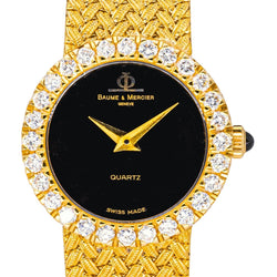 Montre BAUME & MERCIER en or jaune, quartz et diamants - Castafiore