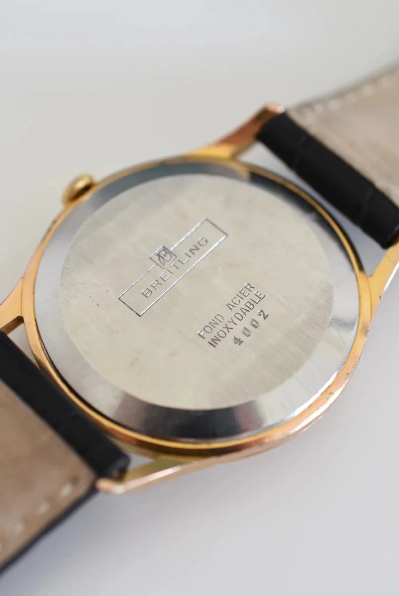 Montre BREITLING Réf. 4002, en plaqué or et acier - Cadran bicolore, Venus 227, Vers 1956. - Castafiore