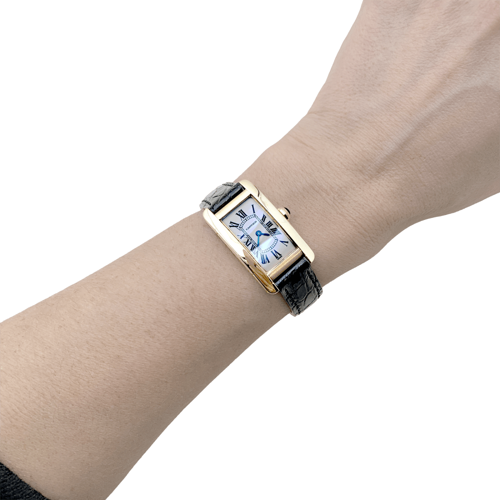 Montre CARTIER "Tank Américaine" en or jaune, acier et cuir - Castafiore