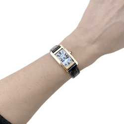 Montre CARTIER "Tank Américaine" en or jaune, acier et cuir - Castafiore