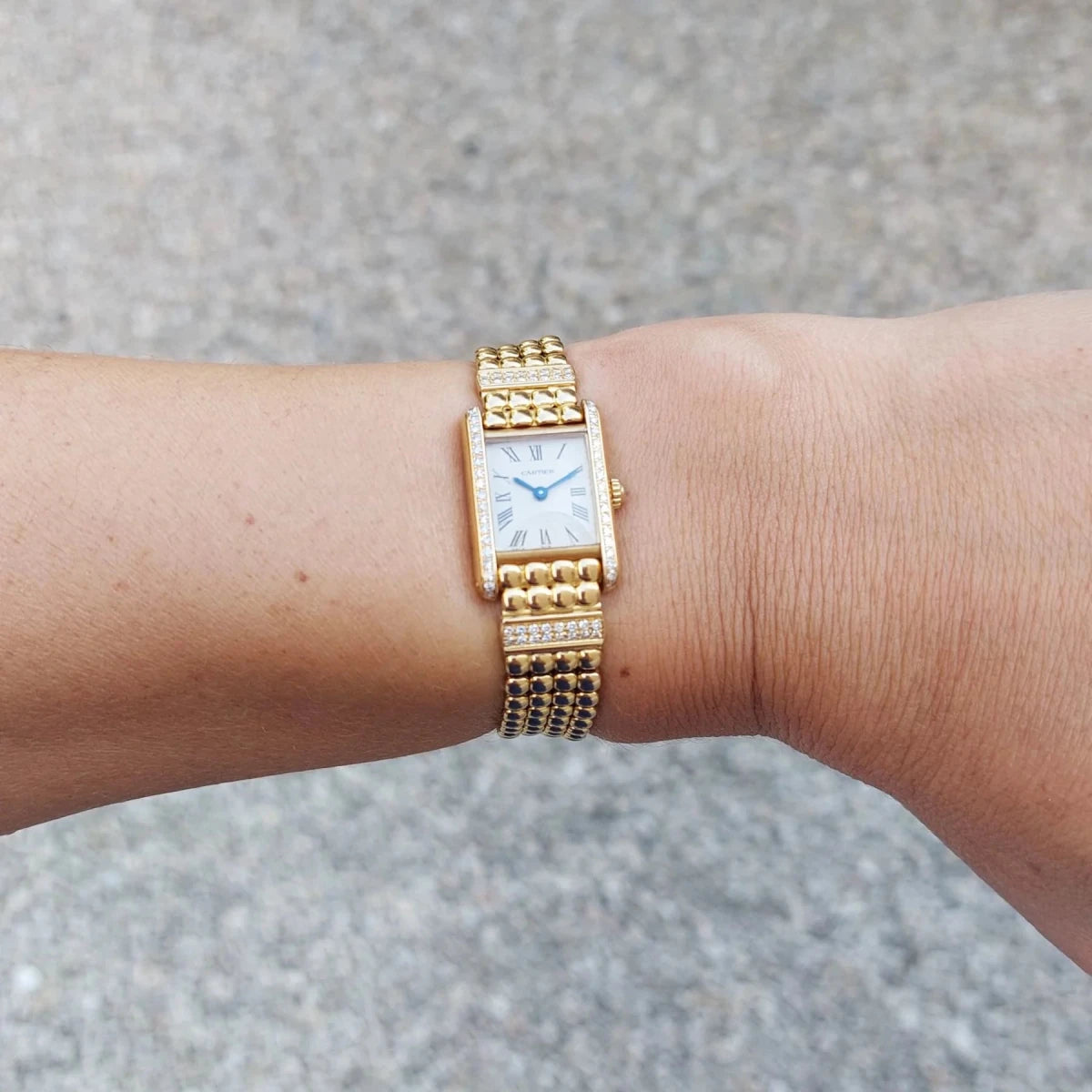 Montre CARTIER "Tank Louis Cartier Mini" en or jaune et diamants - Castafiore
