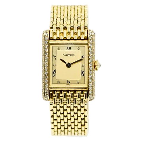 Montre CARTIER "Tank Louis" en or jaune et diamants - Castafiore
