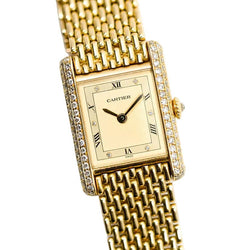 Montre CARTIER "Tank Louis" en or jaune et diamants - Castafiore
