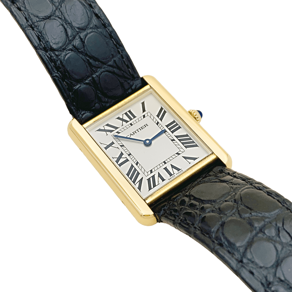 Montre CARTIER "Tank Solo" en or jaune, argent, cuir, acier et spinelle - Castafiore
