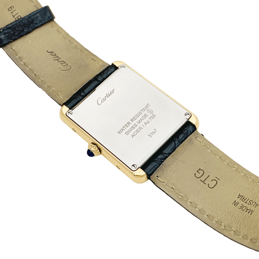 Montre CARTIER "Tank Solo" en or jaune, argent, cuir, acier et spinelle - Castafiore