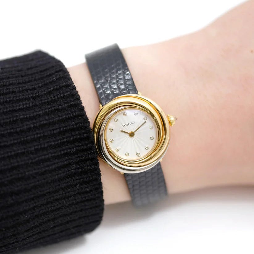 Montre CARTIER "Trinity" en or jaune, or rose, or blanc et cuir - Castafiore
