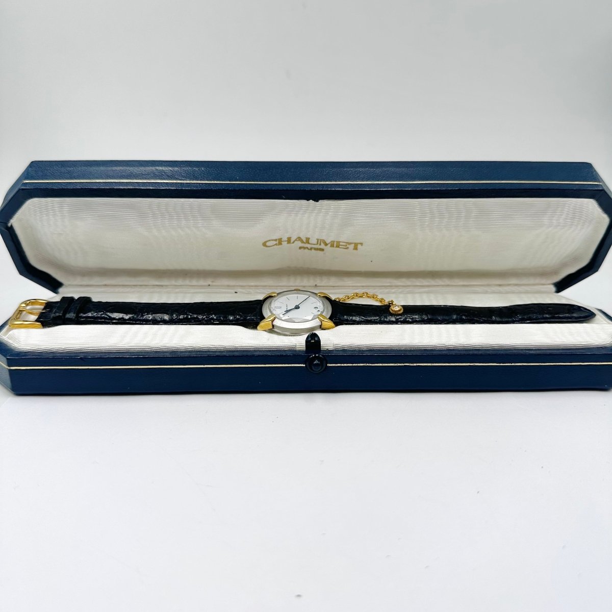 Montre CHAUMET "Élysées" en or jaune, acier, cuir et diamant - Castafiore