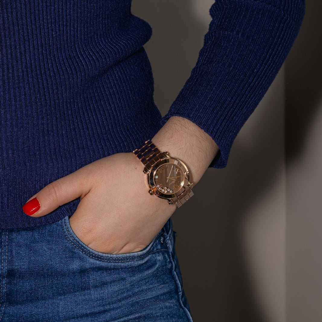 Montre CHOPARD "Happy Sport" en or rose, quartz et diamants - Castafiore