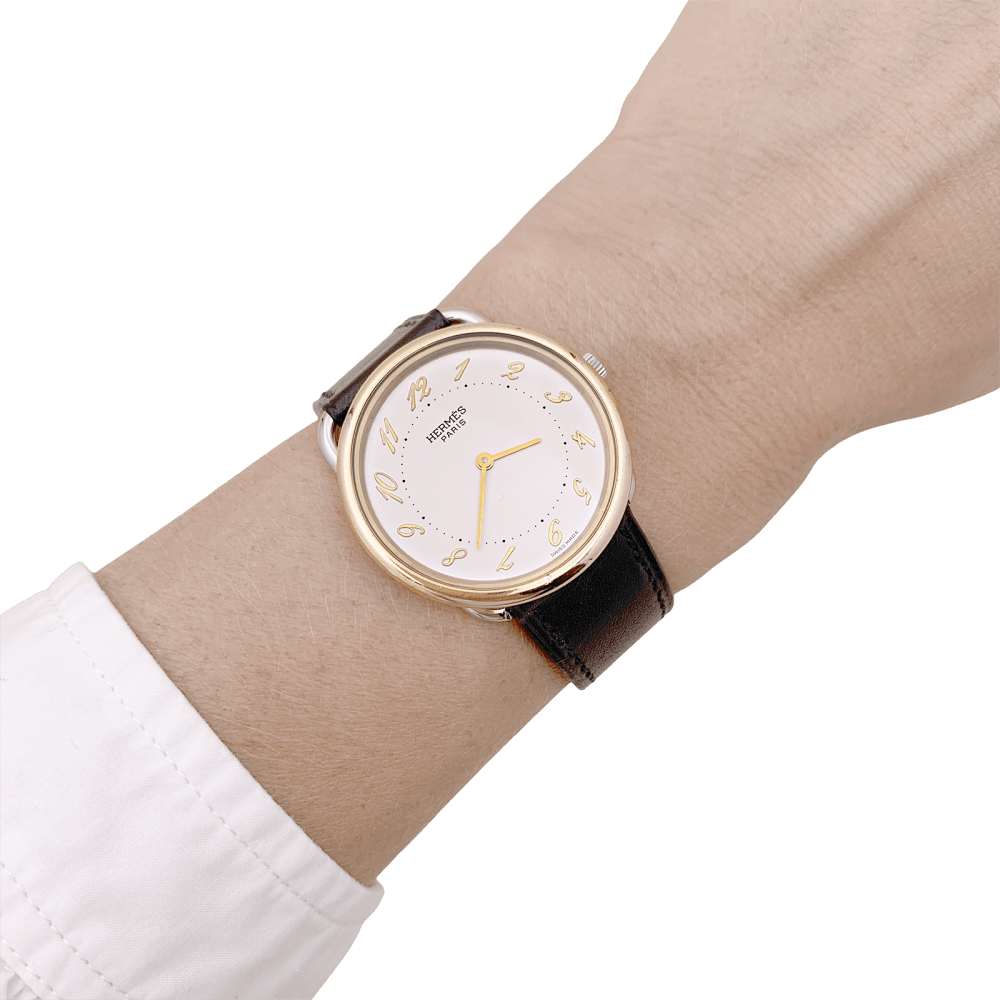 Montre HERMÈS "Arceau" en acier et cuir - Castafiore