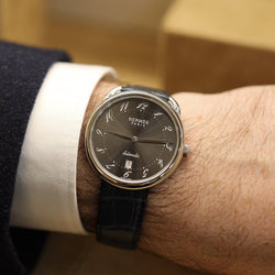 Montre HERMÈS "Arceau" en acier et cuir - Castafiore