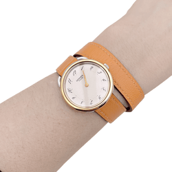Montre HERMÈS "Arceau", plaqué or, acier, cuir. - Castafiore