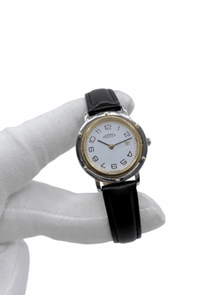 Montre HERMÈS "Clipper" en or jaune, acier et cuir - Castafiore