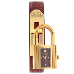 Montre HERMÈS "Kelly" en métal plaqué or et cuir - Castafiore