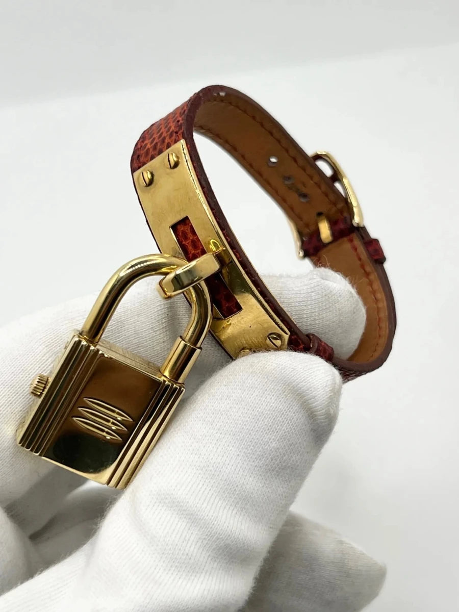 Montre HERMÈS "Kelly" plaqué or, acier et cuir - Castafiore