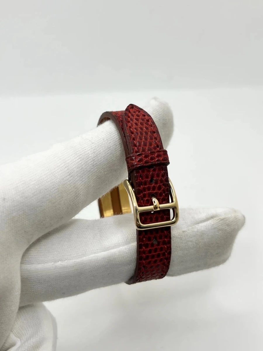 Montre HERMÈS "Kelly" plaqué or, acier et cuir - Castafiore