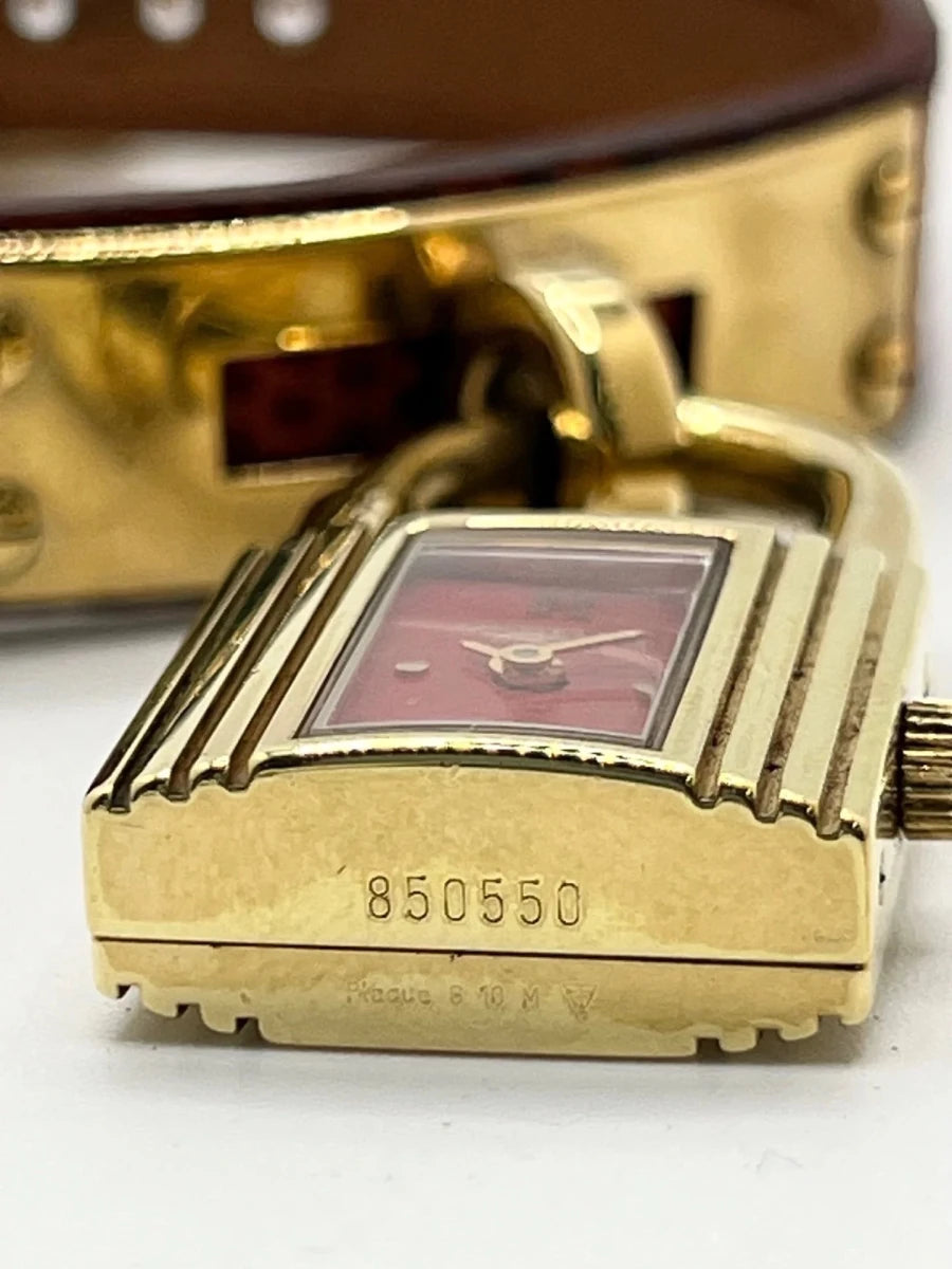 Montre HERMÈS "Kelly" plaqué or, acier et cuir - Castafiore