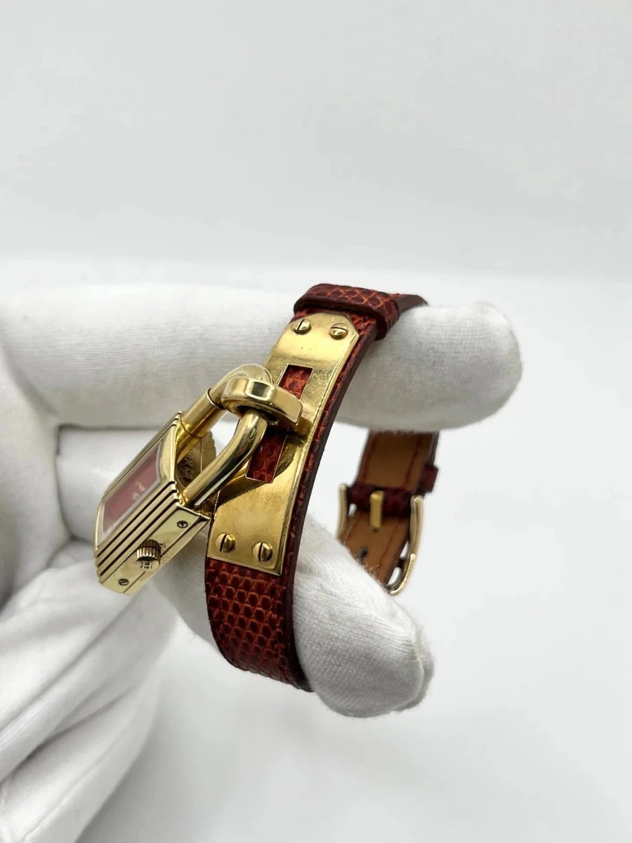 Montre HERMÈS "Kelly" plaqué or, acier et cuir - Castafiore