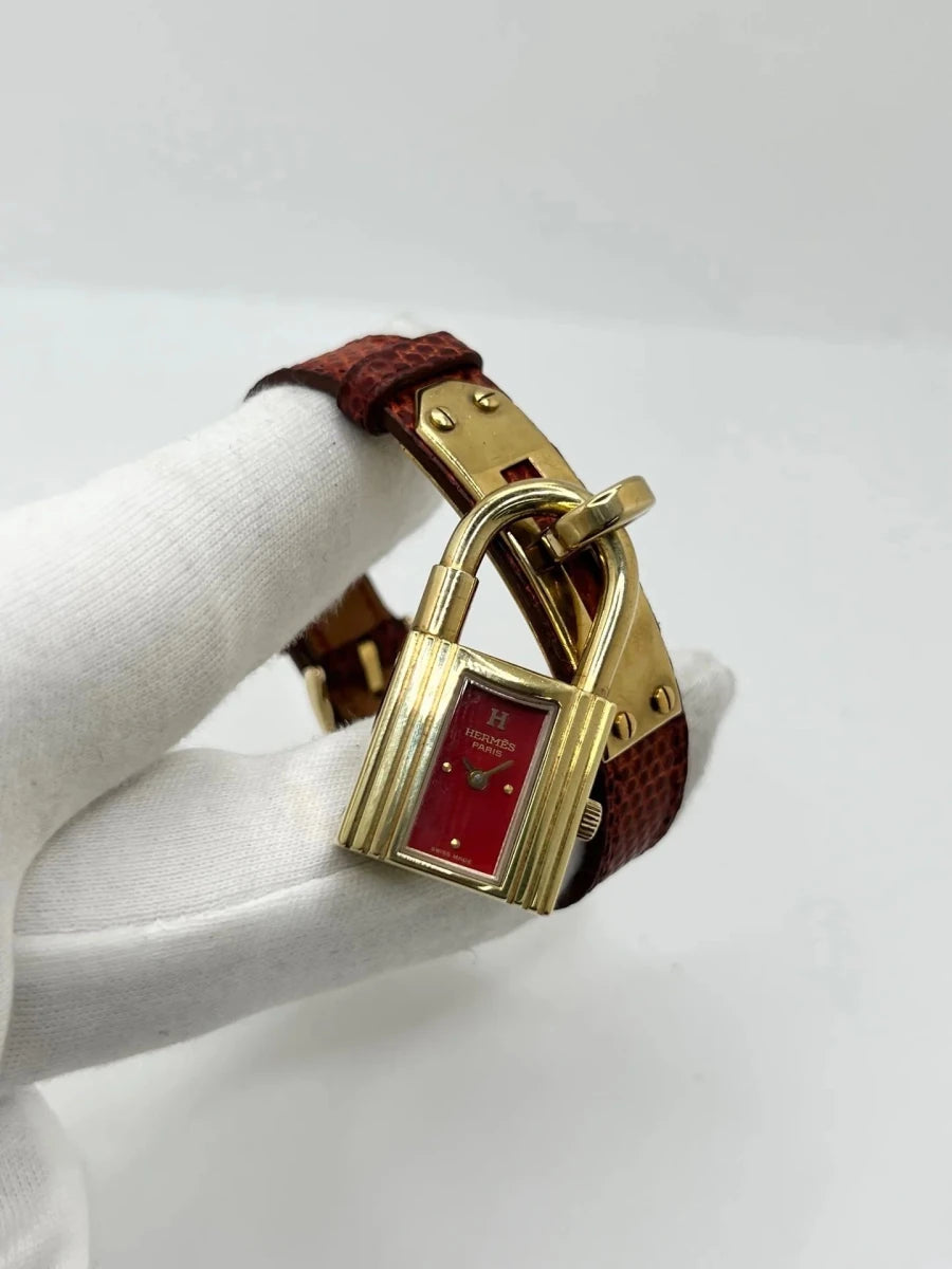 Montre HERMÈS "Kelly" plaqué or, acier et cuir - Castafiore