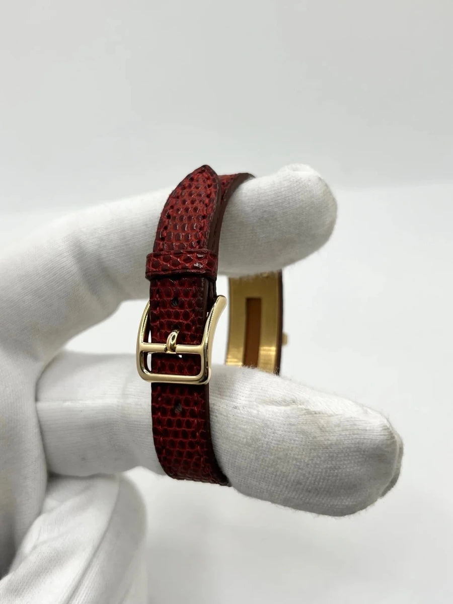 Montre HERMÈS "Kelly" plaqué or, acier et cuir - Castafiore