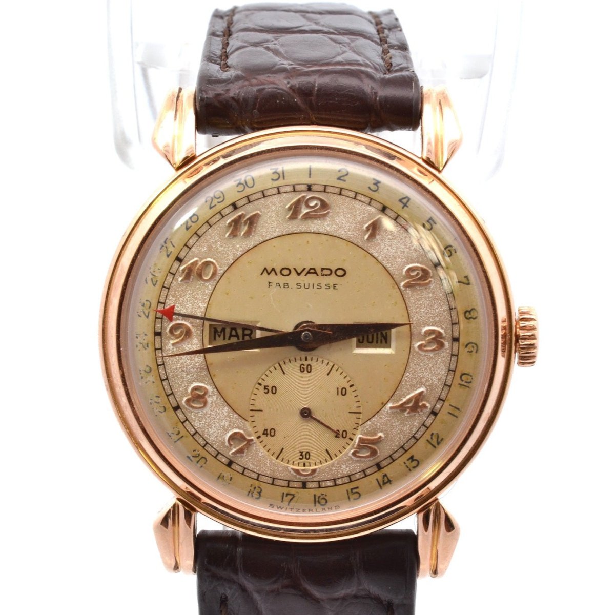 Montre MOVADO "Triple Calendar" en or jaune, plexi et cuir - Castafiore