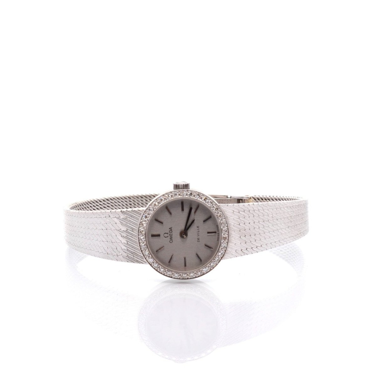 Montre OMEGA "De Ville" en or blanc, saphir et diamants - Castafiore