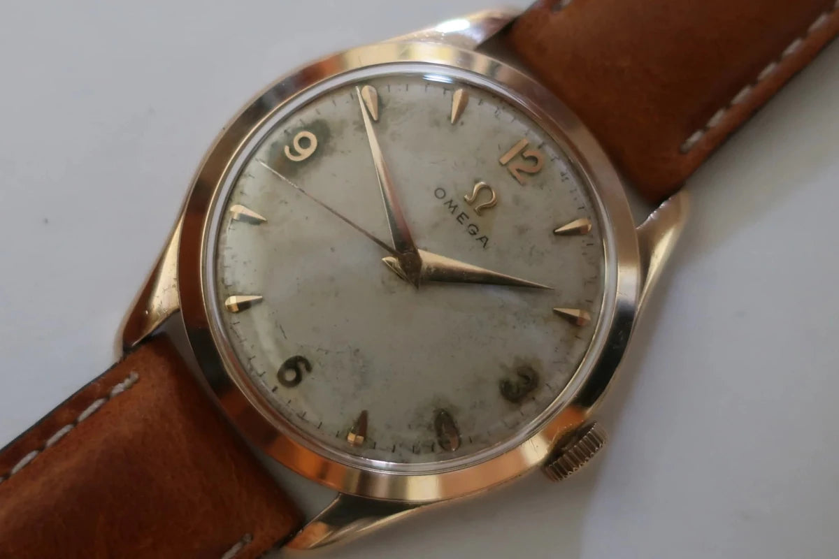 Montre OMÉGA en or jaune et cuir - Castafiore