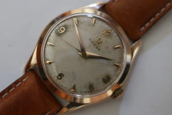 Montre OMÉGA en or jaune et cuir - Castafiore
