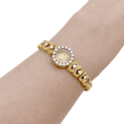 Montre OMEGA en or jaune, or blanc et diamants - Castafiore