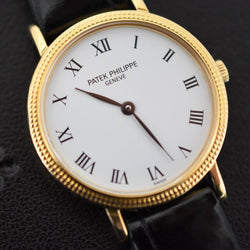 Montre PATEK PHILIPPE "Calatrava Clous de Paris" en or jaune, cuir et quartz - Castafiore