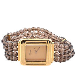 Montre POIRAY en or jaune, quartz et saphir - Castafiore