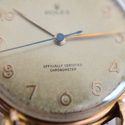 Montre ROLEX "Chronomètre" en or rose, acier et cuir - Castafiore