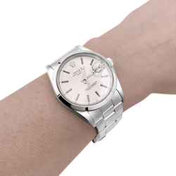 Montre ROLEX "Oyster Perpetual Date" en acier et argent - Castafiore