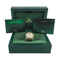 Montre ROLEX "Sky - Dweller" en or jaune, argent, cuir et saphir - Castafiore